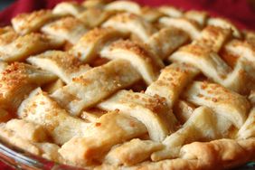closeup of a lattice-topped apple pie sprinkled with demerara sugar