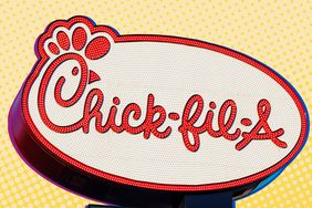 chick fil a sign on yellow background